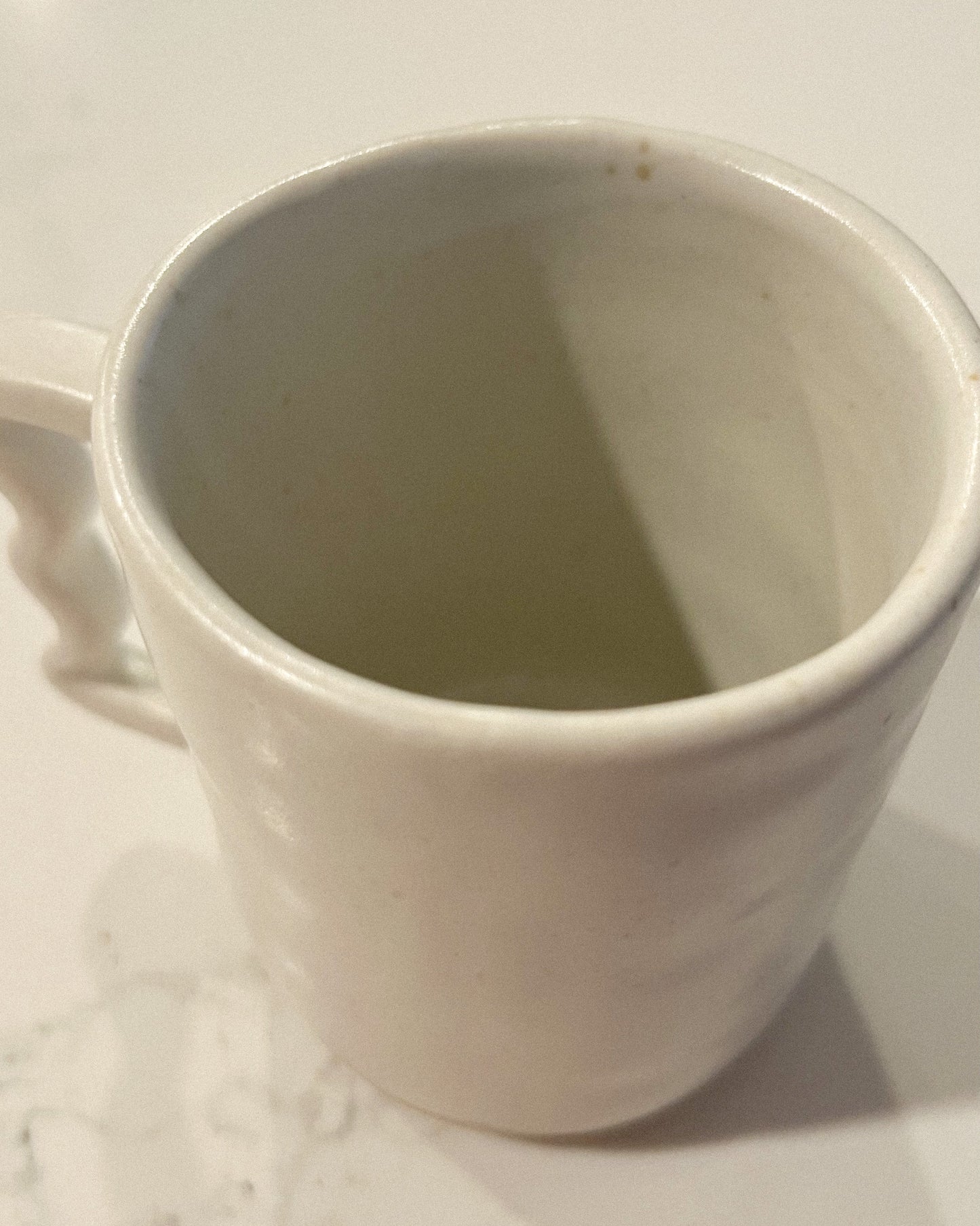 handmade ceramic mug with wavy handle